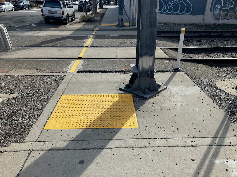 photo of 14th St west side, SacRT overhead wire poles blocking sidewalk